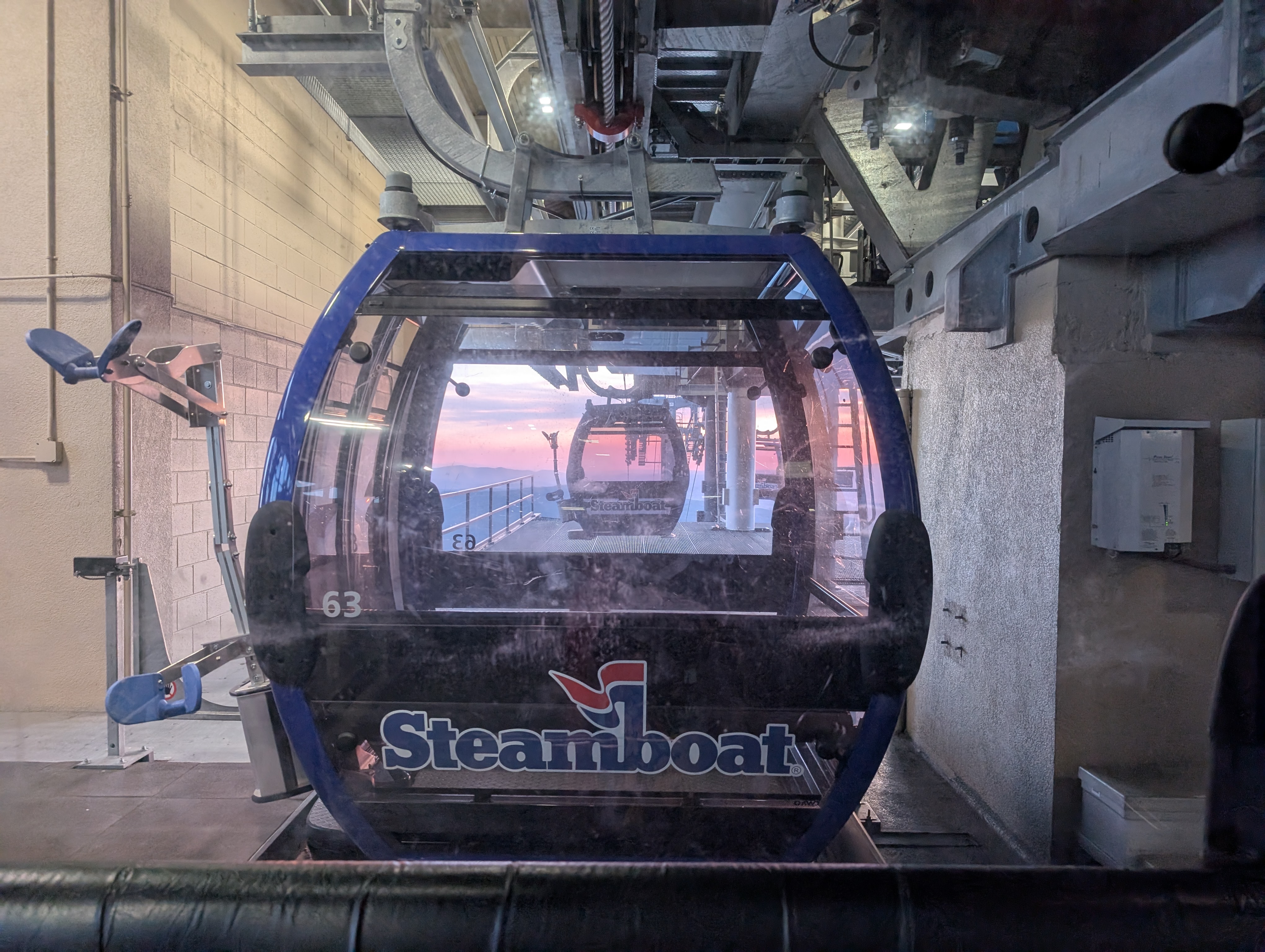 Steamboat gondola with a sunset in the background.